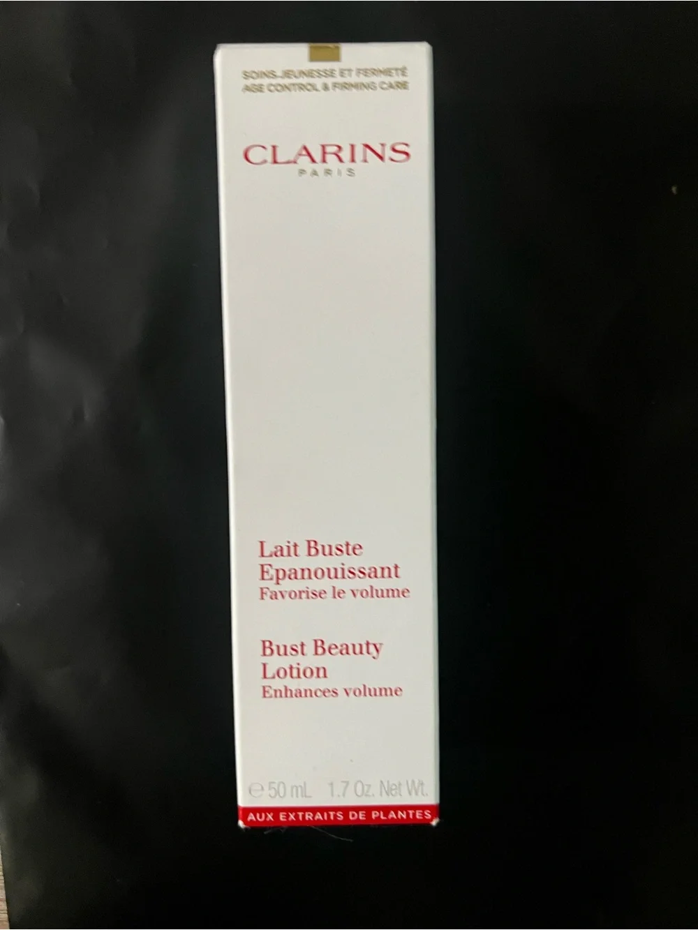 Clarins Bust Beauty Lotion — White with Red Text